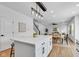 Spacious kitchen with center island, dining area, and hardwood floors at 9724 Brooks Dr, Fishers, IN 46055
