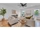 Inviting living room with comfortable seating, stylish decor, and natural light from the windows at 9724 Brooks Dr, Fishers, IN 46055