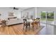 Open layout with kitchen, dining area, and living room with hardwood floors and backyard access at 9724 Brooks Dr, Fishers, IN 46055