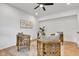 Stylish living room features four chairs, modern ceiling fan, and minimalist artwork at 9724 Brooks Dr, Fishers, IN 46055