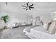 Spacious main bedroom with neutral decor, gray carpet, vaulted ceiling, and natural lighting at 9724 Brooks Dr, Fishers, IN 46055