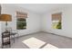 Minimalist bedroom with two windows, neutral carpet, and simple furnishings at 1016 W Creek Ridge Dr, Fountaintown, IN 46130