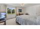 Serene bedroom with natural light, featuring a view of a scenic lake at 1016 W Creek Ridge Dr, Fountaintown, IN 46130