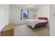 Bright bedroom features a large window with scenic outdoor views and fresh neutral color palette at 1016 W Creek Ridge Dr, Fountaintown, IN 46130