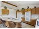 Bright kitchen with island cooktop, ample cabinetry, and updated appliances at 1016 W Creek Ridge Dr, Fountaintown, IN 46130