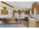Charming kitchen featuring a cooktop island, ample cabinet space, and modern appliances at 1016 W Creek Ridge Dr, Fountaintown, IN 46130