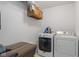Functional laundry room with front loading washer and dryer and overhead storage at 1016 W Creek Ridge Dr, Fountaintown, IN 46130