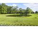 Scenic pond surrounded by lush greenery, offering a tranquil outdoor space at 1016 W Creek Ridge Dr, Fountaintown, IN 46130