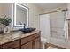 Modern bathroom with a stylish sink, a granite counter, and updated fixtures at 10758 Cyrus Dr, Indianapolis, IN 46231
