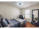 Comfortable bedroom featuring hardwood floors, modern lighting, and a stylish decor at 10758 Cyrus Dr, Indianapolis, IN 46231
