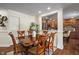 Elegant dining room with a wooden table, seating for six, and natural light at 10758 Cyrus Dr, Indianapolis, IN 46231