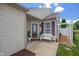 Inviting front porch with a white bench and beautifully landscaped garden at 10758 Cyrus Dr, Indianapolis, IN 46231