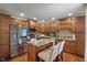 Modern kitchen with stainless steel appliances, granite countertops, and a center island with bar seating at 10758 Cyrus Dr, Indianapolis, IN 46231