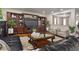 Stylish living room with built-in shelving units, ample natural light and hardwood floors at 10758 Cyrus Dr, Indianapolis, IN 46231