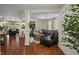 Open-concept living room with hardwood floors and plenty of natural light at 10758 Cyrus Dr, Indianapolis, IN 46231