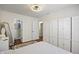Bright main bedroom showcasing hardwood floors, closet and dressing areas, and natural light at 10758 Cyrus Dr, Indianapolis, IN 46231