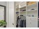 Spacious walk-in closet with built-in shelving, hanging racks, and ample storage space at 10758 Cyrus Dr, Indianapolis, IN 46231