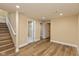 The finished basement area has wood floors and stairs leading to the main floor at 1122 W 35Th St, Indianapolis, IN 46208