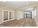 Bright living room boasts fresh paint, recessed lights, new floors, and opens to the modern, remodeled kitchen at 1122 W 35Th St, Indianapolis, IN 46208