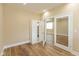 The light-filled office features wood floors, glass paneled french doors, and a closet at 1122 W 35Th St, Indianapolis, IN 46208