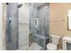 The modern shower features beautiful tile, and built in shampoo and soap trays at 1122 W 35Th St, Indianapolis, IN 46208