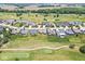 Aerial view captures beautiful homes in a lush green community with golf course at 1165 Maclaren Ct, Franklin, IN 46131