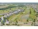 An aerial shot shows a community nestled around a beautiful golf course with ponds at 1165 Maclaren Ct, Franklin, IN 46131