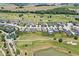 Aerial view of lovely homes situated by a golf course and serene ponds at 1165 Maclaren Ct, Franklin, IN 46131