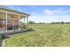 Inviting backyard patio with a seating area and expansive lawn at 1165 Maclaren Ct, Franklin, IN 46131