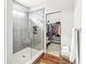 Beautiful bathroom with tiled shower, glass door, and a walk-in closet at 1165 Maclaren Ct, Franklin, IN 46131