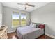 Cozy bedroom with large windows offering a scenic view at 1165 Maclaren Ct, Franklin, IN 46131