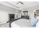 Bright bedroom featuring tray ceiling, carpet, and access to the outdoors at 1165 Maclaren Ct, Franklin, IN 46131