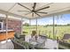 Relaxing covered patio with wicker furniture, fan, and scenic views for the best outdoor experience and backyard entertainment at 1165 Maclaren Ct, Franklin, IN 46131