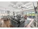 Open-concept living area with kitchen, dining, and living spaces, featuring hardwood floors and modern decor at 1165 Maclaren Ct, Franklin, IN 46131