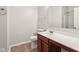 Bathroom featuring a cherry wood vanity and a sink with white countertop at 12604 Buck Run Dr, Noblesville, IN 46060