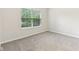 Bright bedroom features carpet and large window at 12604 Buck Run Dr, Noblesville, IN 46060