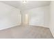 Spacious bedroom features neutral carpet and two entry doors at 12604 Buck Run Dr, Noblesville, IN 46060