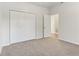 Bedroom featuring carpet, a closet, and a view into another room at 12604 Buck Run Dr, Noblesville, IN 46060