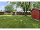 A serene backyard featuring a shed and a well-maintained lawn at 1346 Carroll White Dr, Indianapolis, IN 46219