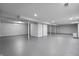 A spacious unfinished basement with white walls and concrete floors, ready for customization at 1346 Carroll White Dr, Indianapolis, IN 46219