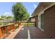 A wooden deck with steps leading to the backyard at 1346 Carroll White Dr, Indianapolis, IN 46219