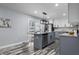 Modern kitchen boasting an island, stainless steel appliances, and stylish two-tone cabinetry at 1346 Carroll White Dr, Indianapolis, IN 46219