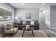 Cozy living room with a comfortable sofa, stylish decor, and a window providing natural light at 1346 Carroll White Dr, Indianapolis, IN 46219