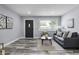 Inviting living room with modern decor, a neutral color palette, and ample natural light at 1346 Carroll White Dr, Indianapolis, IN 46219
