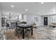 Open-concept living space featuring modern furnishings and a seamless flow into the dining area and kitchen at 1346 Carroll White Dr, Indianapolis, IN 46219