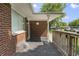Charming covered porch with brick detailing, offering a welcoming entrance to the home at 1346 Carroll White Dr, Indianapolis, IN 46219