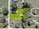 Aerial view of a property with a well-manicured lawn, house, and outbuilding at 1511 E 20Th St, Muncie, IN 47302