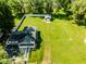 Aerial perspective showcasing a home, expansive backyard, and detached shed at 1511 E 20Th St, Muncie, IN 47302