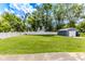 Spacious, green backyard with a detached shed and white picket fence at 1511 E 20Th St, Muncie, IN 47302