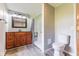 Bathroom featuring dark wood vanity, new shower, and toilet at 1511 E 20Th St, Muncie, IN 47302